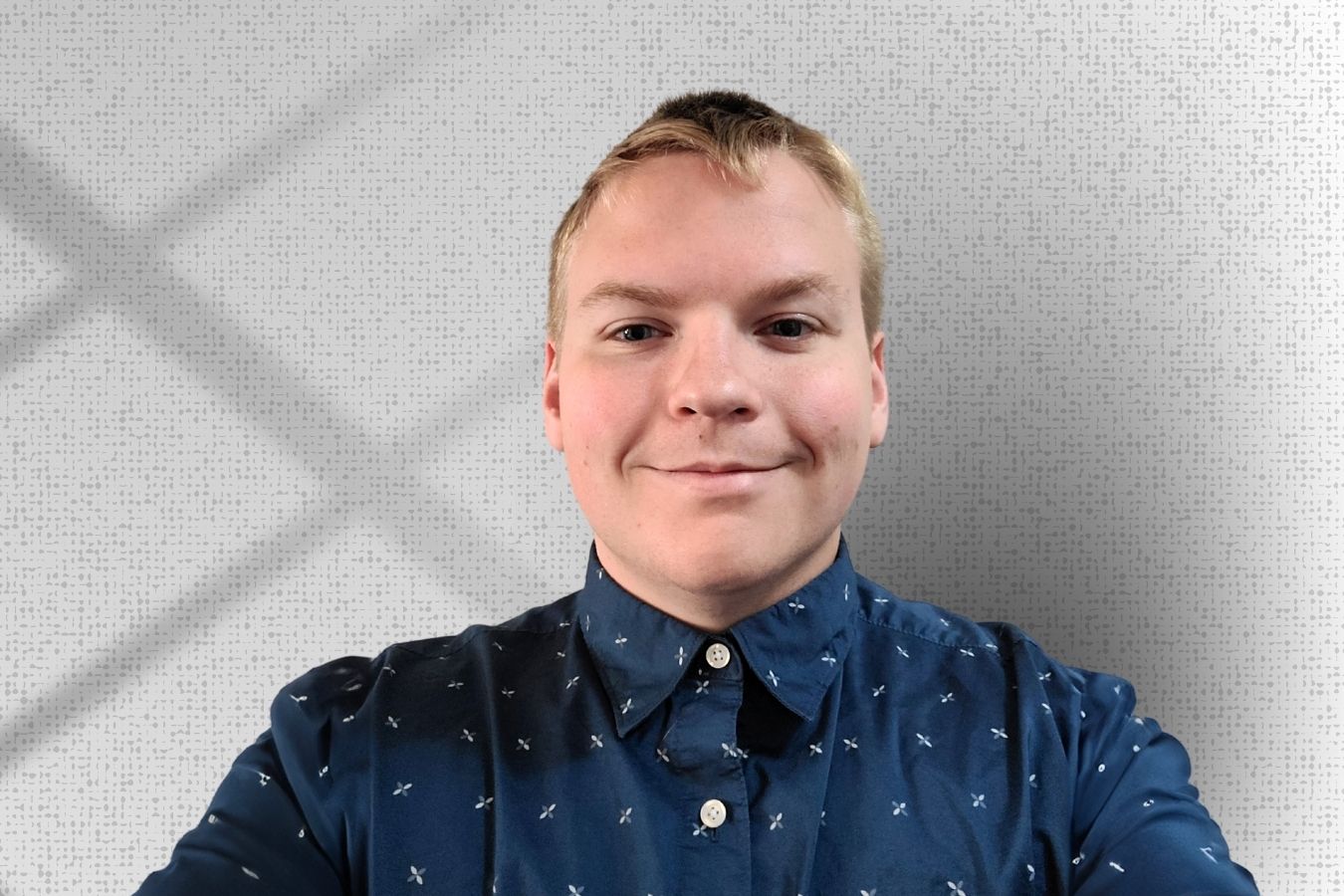 Zach Rorhbach in front of a white background.